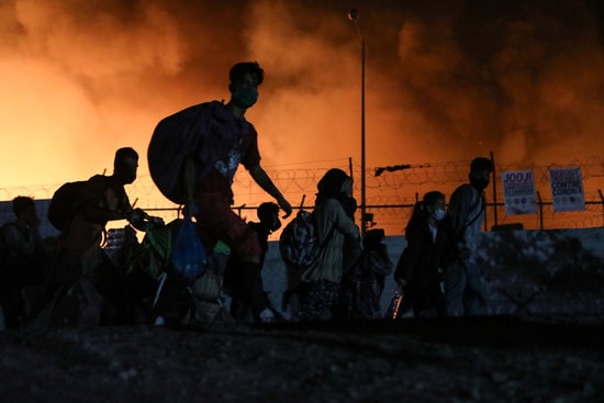 People fleeing the fire at Moria refugee camp in Greece on September 9, 2020 (Source: Reuters)